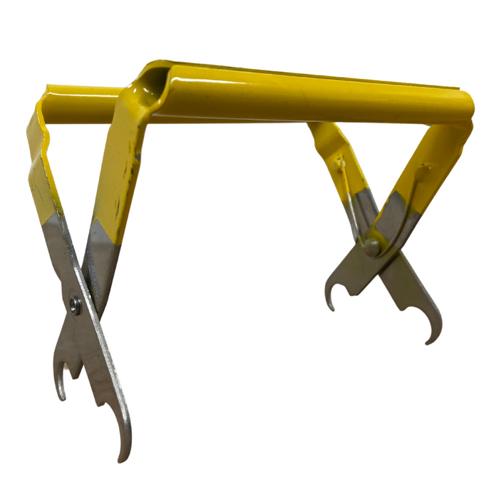 Yellow stainless steel frame grip with scraper for lifting hives during beekeeping hive inspections.